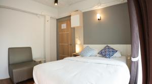 Postel nebo postele na pokoji v ubytování Prix Hotel