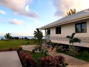 a house with a view of the ocean at Moanaura Lodge in Apomaoro