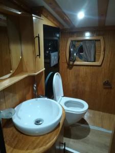 a bathroom with a white toilet and a sink at cemal efe in Fethiye