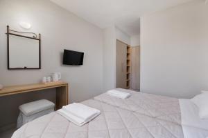 Voodi või voodid majutusasutuse Louvre Hotel toas