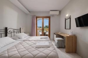 Voodi või voodid majutusasutuse Louvre Hotel toas