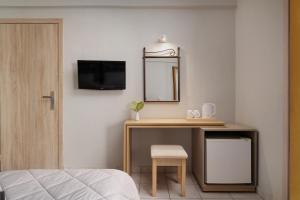 Televiisor ja/või meelelahutuskeskus majutusasutuses Louvre Hotel