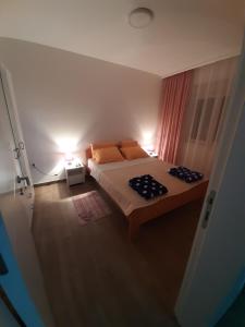 Postel nebo postele na pokoji v ubytování Apartman Jass