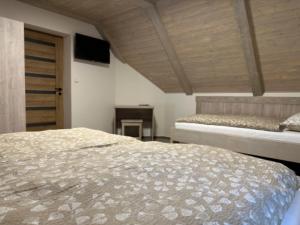 Una cama o camas en una habitación de Apartmány VESNA