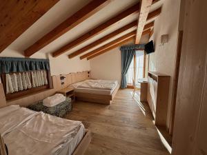 Postel nebo postele na pokoji v ubytování Residence Cima Tosa
