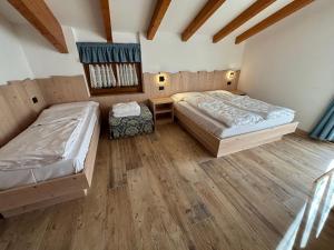 Postel nebo postele na pokoji v ubytování Residence Cima Tosa