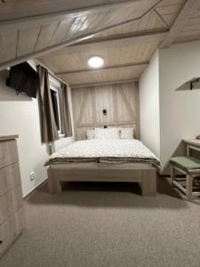Una cama o camas en una habitación de Apartmány VESNA