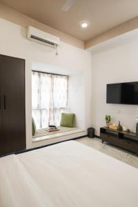 A television and/or entertainment centre at Firebrick Boutique Residences - GARNET HOUSE