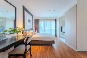 Somerset Park Suanplu Bangkok客房内的一张或多张床位