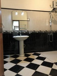 a bathroom with a sink and a mirror at Candle House in Kalutara North +82 photos