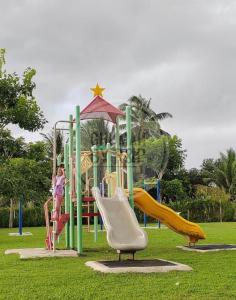 a playground with slides in a park at Ghumah by R&P (near Hospital Sultanah Bahiyah) in Alor Setar