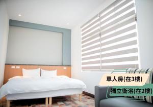 Postelja oz. postelje v sobi nastanitve 西湖柚子家民宿