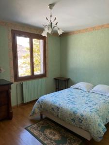 מיטה או מיטות בחדר ב-Villa Le Rocher