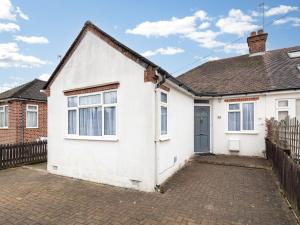 a white house with a brick driveway at Pass the Keys Family Friendly 3 Bed Home In Pinner Pets Welcome in Pinner