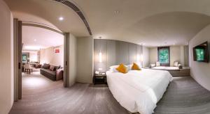 Postel nebo postele na pokoji v ubytování The Gaia Hotel - Taipei
