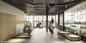 a gym with a woman working out in the gym at Compassone - 2bd Luxury Apartment Free Gym & Pool in Ấp Phú Thọ