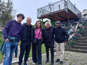 a group of people standing in front of some stairs at Ruchi House in Nuwara Eliya