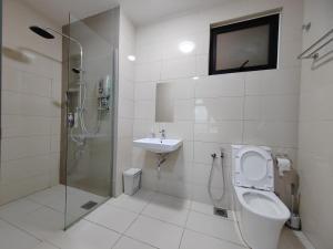 a bathroom with a shower and a toilet and a sink at Paradigm Residence in Johor Bahru