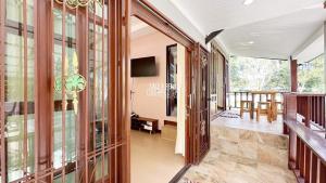 a hallway of a house with glass doors at Happy Home Villa 1 in Nathon Bay