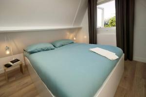 Postel nebo postele na pokoji v ubytování Het mooiste vakantiehuisje in Durbuy + 39 fotografií
