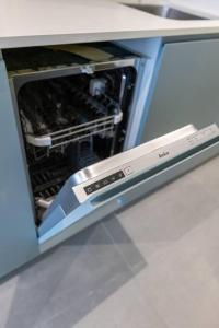an open microwave oven with its door open at Estudio moderno y acogedor en Madrid Rio nº1 in Madrid