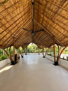 a large wooden pavilion with a large ceiling at Terra Resort in Ahangama