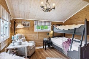 Ένα ή περισσότερα κρεβάτια σε δωμάτιο στο Cozy and comfortable cabin in the center of Sjusjøen with a large terrace +12 φωτογραφίες