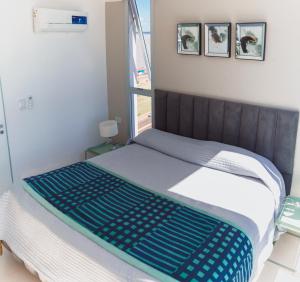 Кровать или кровати в номере Departamento chic Costanera Posadas