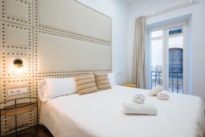 Giường trong phòng chung tại Ninesuites Cathedral