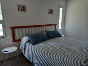 Postel nebo postele na pokoji v ubytování La Rosa del Azafrán - Alojamiento Rural - Ranchos de Vacaciones en Entre Ríos + 37 fotografií