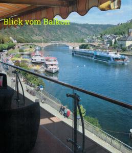 a view of a river with boats in the water at Moselapart in Cochem