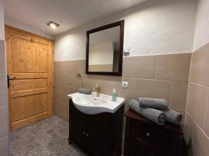 a bathroom with a sink and a mirror at Insel 8 in Wernigerode +13 photos