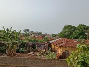 a group of old buildings in a village at Appat'Adjanohoun in Ouidah