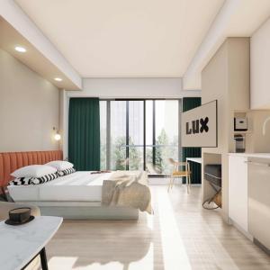 a bedroom with a bed and a large window at LUX Place in Ottawa