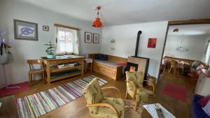 a living room with a couch and a table at 11er Häusl in Flachau