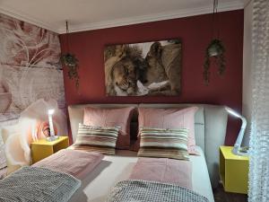 a bedroom with two beds and a mirror on the wall at Ferienwohnung Ache in Oetz