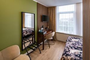 TV a/nebo společenská místnost v ubytování Jupiter Hotel