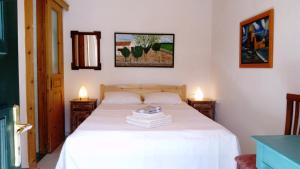 Кровать или кровати в номере ZACHAROULA ROOMS 2