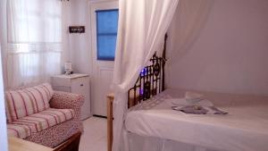 Кровать или кровати в номере ZACHAROULA ROOMS 2