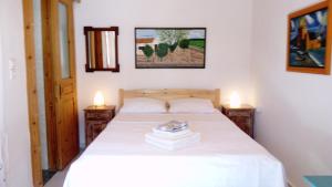 Кровать или кровати в номере ZACHAROULA ROOMS 2