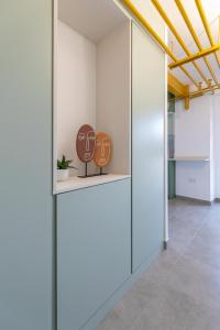 a hallway with two masks on display in a building at Estudio moderno y acogedor en Madrid Rio nº 9 in Madrid