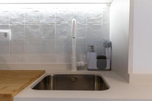 a kitchen sink with a candle on top of it at Estudio moderno y acogedor en Madrid Rio nº 9 in Madrid