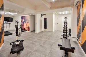 a gym with several exercise equipment in a room at 02.Studio#Charenton#Fitness#Cinema in Charenton-le-Pont