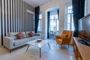 a living room with a couch and a table at 5 Apartment Galata in Istanbul