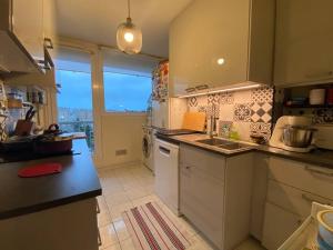 a kitchen with a sink and a counter top at Appartement entier 3 pieces. in Argenteuil