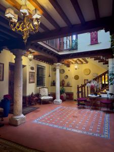 a living room with a rug on the floor at Almunia de San Miguel in Toledo