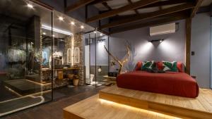 Postel nebo postele na pokoji v ubytování Rockinnest Hotel El Nido
