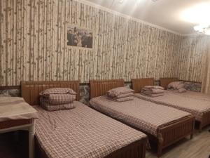 Yabuli Farm House Hotel tesisinde bir odada yatak veya yataklar