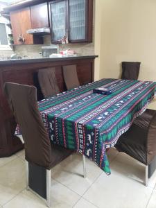 a table with a blanket on top of two chairs at Family Friendly Appartement-Giza in Cairo