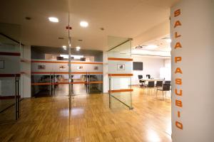 an office with a room with a table and chairs at Schio Hotel in Schio